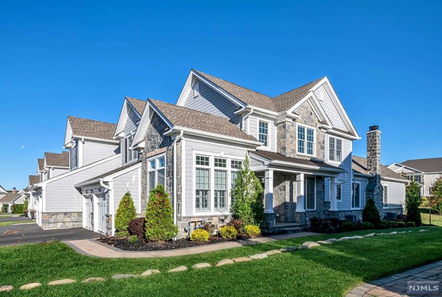 Find chic design grounded in luxury and carefree living in this expanded Ashton Model within the Reserve at Franklin Lakes. A rare blend of sophistication and functionality, this property is ideal for a primary residence or a stylish pied-a-terre. Step into a 2-story entry showcasing a work-from-home office and a refined DR. The top-of-the-line kitchen seamlessly connects to a welcoming GR, extending to an outdoor living space with retractable screens, an expanded deck, and an outdoor Kit. The first-floor primary suite exudes tranquility with luxe amenities. Upstairs, a loft offers a perfect retreat, accompanied by two bedrms with walk-in closets and a shared bth. The LL features a media rm, rec space, gym, sauna, office, full bathroom, and storage. Hardwood floors, custom automatic blinds, shutters, lighting, and security enhance the home. 5 star Club House w/billiards, gym, yoga rm, lockers, pool, tennis, bball, playground! Steps away from town lakes and hiking trails.