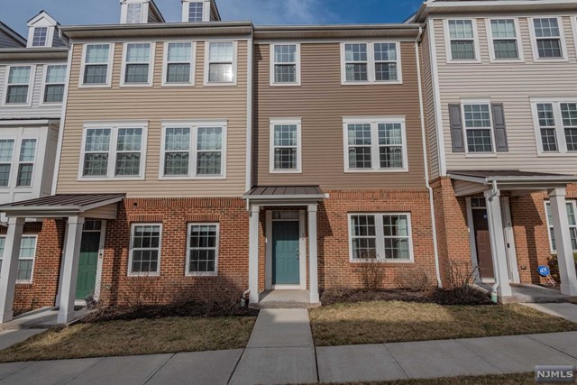 BEAUTIFUL IMMACULATE LIKE NEW TOWN HOME LOCATED IN A DESIRABLE WOOD RIDGE TOWNHOUSE COMMUNITY, WITH ONSITE TRAIN STATION FEATURES 4 BEDROOMS/3 FULL BATH, OPEN CONSEPT LAYOUT, A TIMELESS KITCHEN WITH NEWER HIGH-END APPLIACES LEADING TO A DECK. A MASTER SUITE WITH A SOAKING TUB AND A WALK-IN CLOSET, LAUNDRY ROOM ON THE SECOND FLOOR, 2 OTHER BEDROOMS ON THE SECOND FLOOR AND A MAIN BATH. GROUND LEVEL HAS A BEDROOM AND A FULL BATH, STORANGE AND A TWO CAR GARGE. LOCATED IN PROXIMITY TO NJ TRANSPORTATION, PARKS, DOG RUN, SCHOOL, RESTAURANTS AND SHOPPING.