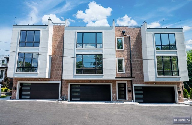 NEW CONSTRUCTION LUXURY townhome in the heart of Palisades Park! You're not going to want to miss this! Ground level has a half bathroom, spectacular recreation room and mud room closet with side entrance, ample closet space and a two car garage. First floor boasts an open floor plan. It has a large custom kitchen with high end appliances, and a tremendous stunning quartz island! Living room with fireplace and impressive builtins. Magnificent red oak floors throughout the entire unit, zoned central Hvac, built in vacuum on each floor, custom closets. Second floor has 3 bedrooms including one primary suite with custom walk in closet and an extraordinary master bath. This home boasts many extra features including a large ROOFTOP terrace with city views! Taxes to be independently verified as this is new construction.