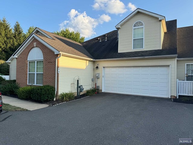 Very Bright & Beautiful end-unit in highly desirable Hillsborough Point 55+ community. Extremely maintained home offers a cozy inviting atmosphere. Cute Eat-In Kitchen with matching white appliances, large amount of cabinets, with a nice pass-thru window to the dining room, gives the feel of an open concept living. FDR is perfect for entertaining, which includes recessed lighting to help create the ideal ambiance. the living room has an amazing arched window, vaulted ceiling, & recessed lighting. Primary Bed Room is spacious with a walk in closet, recessed lighting, twin double-hung windows, & ceiling fan. Primary bath is large and bright. The 2nd BR offers a variety of uses. Convenient 1st Floor laundry w/ washer & dryer. Upstairs Bed Room provides a 2nd primary suite, w/private bath & closet. Porch is enhanced by an awning fence, providing a cozy outdoor space Also included is a Spacious two-car garage. Community amenities include an exercise room and a clubhouse.