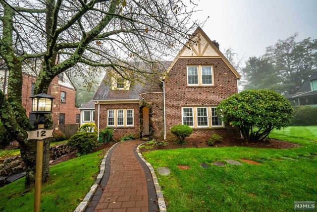 Storybook renovated Tudor nestled on a double lot in a coveted Upper Gregory location! This home boasts one of a kind style and character just 1 block from Jitney Shuttle for easy NYC transportation offering central air, master BR w/ private bath & WIC, & an outstanding layout with a luxury feel!