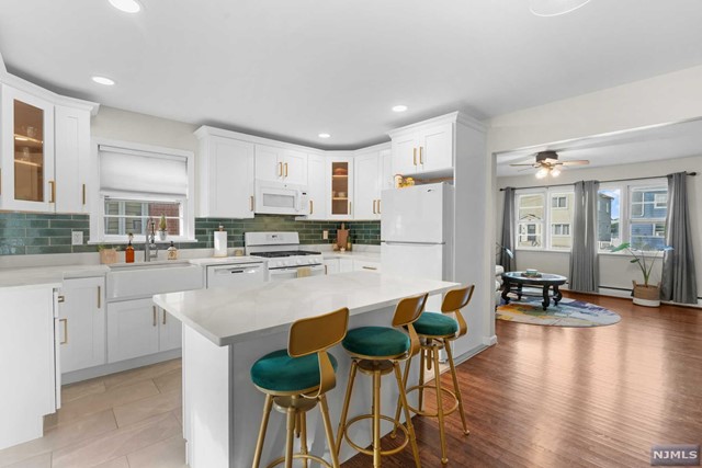 Welcome to this beautifully renovated 2 bedroom, 1bath apartment in the heart of Clifton, New Jersey. This charming unit offers spacious bedrooms, perfect for comfortable living. The apartment also features a massive basement, complete with your own washer and dryer, ideal for additional storage. Enjoy the convenience of 2 designated parking spots and access to a lovely backyard. Located close to many local amenities, including shopping, dining, and public transportation. The apartment is move-in ready, blending modern updates with cozy living spaces. Don't miss out on this fantastic rental opportunity in a prime location!