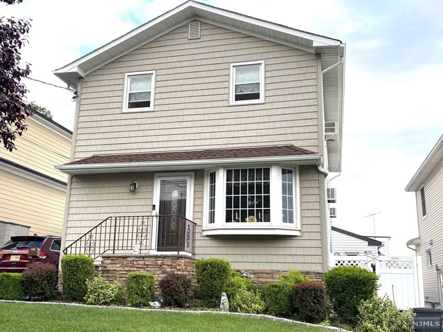 Beautiful ultra modern apartment with a light open concept design. Features sparkling white kitchen with refrigerator, dishwasher, gas range and microwave, large living room, dinning area, 2 bedrooms, tile bath, hardwood floors, attic storage, hookups for stacker washer & dryer, and a lovely rear deck with breathtaking western views!