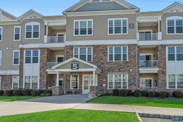 Step into this impeccably maintained residence &enjoy the charm of 2BRs/2.5 baths model home. Bright &airy, w/lovely private woods views, this unit is tastefully appointed. Featuring freshly painted walls, brand-new commercial -grade laminate flooring, &an open floor plan, creates a warm &welcoming environment. The kitchen boasts granite countertops& SS/appliances which overlooks a breakfast bar& DR. The LR opens to a private covered terrace, & side-by-side washer &dryer included for convenience. Both BRs offer wood floors & walk-in closets, with the primary BR boasting a luxurious en-suite bath. Additional amenities include underground parking & a storage unit. Located within an active adult community for those 55 & over, residents enjoy access to a clubhouse, pools, fitness center, tennis courts, & more. Conveniently situated near Rockaway Mall, shops, restaurants, & transportation, this is an opportunity not to be missed. Experience refined living in this exceptional residence.