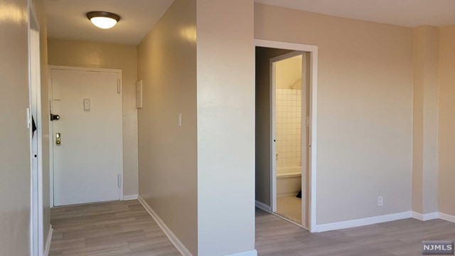 Commuter's Dream. End Unit Studio for sale at the Prestigious Carlton Tower in Passaic Park. Excellent Location. Bus stops at the corner and train station within walking distance. It is a short distance to the beautiful Memorial Park, with an ice skating ring and a coffee shop, and it is 3 miles long of walking around the artificial little lake with a waterfall and perennial vegetation. This building is rich in amenities. 24/7 Doorman & concierge, Laundry facility in the basement, Sabbath elevator, outside swimming pool, barbecue, and a large patio added enjoyment to residents. The very low maintenance fee included gas, electricity, water, sewer, snow removal, and heat. Pets are allowed for a modest fee. There is an assessment to cover the updates that will bring the building to excellent condition for many years to come. Updates Incl.: Garage /parking reconstruction. Brick pointing/replacement, Exterior painting, Roof replacement. Fire alarm system, Electric, Landscaping HVAC