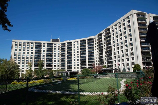 One-floor luxury apartment with incredible building amenities, breathtaking mountain and sunset views. Move right into this spacious, completely renovated, light, bright two bedroom, two bath apartment with open floor plan. Living-dining room combination provides expansive feel, multiple sitting areas and plenty of room to entertain. The European style kitchen with custom cabinets, Jenn Air appliances, oversized metal farm sink, has a tile backsplash that adds sparkle to the glamour. No detail has been overlooked -- ceramic tile floors throughout the apartment and on the spacious balcony and matching Silhouette blinds throughout the apartment present a cohesive design/flow-through, lighting fixtures are contemporary and strategically placed, both bathrooms feature RH Modern vanities, step in showers with glass doors, glass tiles in the shower and high-end fixtures, also a hidden, stackable LG washer/dryer.