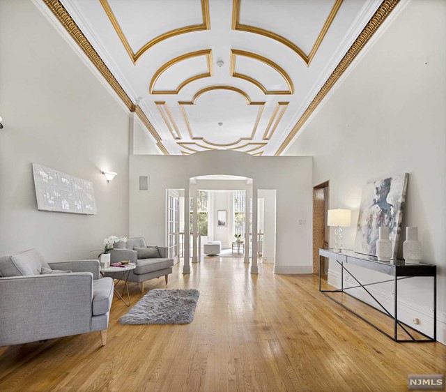 Rarely available 25 foot wide magnificent duplex condo located on the most desirable street in Hoboken. This spacious home encompasses 2,376 SF of living space, 3 bedrooms, 3 full bathrooms, a renovated front patio, covered deck leading to the yard, and 1 private off-street parking space. This condo exemplifies the seamless integration of old world historic details & timeless modern living & design. The parlor level features soaring 14 foot ceilings with original crown moldings, an open eat-in kitchen with Viking stove, Sub-zero refrigerator & a wine fridge, two living room areas, and a full bath. The garden level has 3 bedrooms & 2 full bathrooms - a large master bedroom with an en-suite bathroom with a jacuzzi & a walk-in closet, a second generously sized bedroom, and a third bedroom ideal for a nursery or a home office. Other features include a stained glass window, oak hardwood floors, a full size W/D, central heat & AC with a humidifier, & additional storage in the basement.