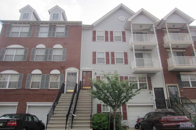 Great townhouse with easy access to light rail and downtown Newark. Features living room with outdoor balcony,dining room, kitchen & powder room on 2nd level, two bedrooms, two baths on 3rd level Master bedroom features master bath with soaking tub and outdoor balcony. Washer and dryer in unit. Wall to wall carpeting throughout. Detached garage with storage room plus additional parking in tandem outside marked 21 H. Great location near city subway and downtown Newark. Visitor parking requires visitor pass from complex security. Call security. for delivery of pass upon parking. All cars without pass or illegally parked will be tire booted and fined a fee of $225.