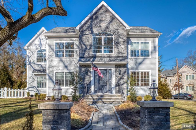 Welcome to this exquisite home with architectural details conveniently located near downtown, transportation, and schools! The first floor feature's a chef's kitchen with stone countertops and high-end appliances which flows nicely to a formal dining room, family room with a gas fireplace to enjoy cozy nights. An open floor plan allows for convenient every day living. The 1st floor features an en-suite guest bedroom for extended family living. The second floor boasts a primary suite with soaring cathedral ceilings and luxurious oversized marble master bathroom and soaking tub with custom walk in closets. A junior suite has a full bathroom, plus 2 additional bedrooms and a full bath. Convenient 2nd floor laundry. The fully finished basement offers endless possibilities. The 2 car detached garage has a 400 sq finished loft space ideal for recreation. Enjoy a spa experience in the back yard hot tub and also a sauna system. Tesla charger on site. Must see!