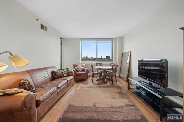 Welcome to 800 Jackson Street, Apt 906, a luxurious 2-bedroom, 2-bathroom apartment in one of Hoboken's most sought-after buildings. 1030sqft. This modern, sun-drenched unit features breathtaking panoramic views of the Manhattan skyline, and an open floor plan designed for contemporary living.Living and dining space boasts an easterly view allowing fort natural light and showcasing spectacular views. A door leads to your balcony to enjoy the sunrise over Manhattan or the wonder of The City that never Sleeps by night.Modern finishes include stainless steel appliances, granite countertops, and a tiled backsplash.Primary Suite is a tranquil retreat with a walk-in closet, an intelligently designed built in closet, an ensuite bathroom featuring double vanities, and jetted tub. Take in the same Easterly views from the comfort of your bed.Guest bedroom is bright and airy, with ample closet space and access to the same private balcony.BUILDING GYM & 1 DEEDED PARKING SPACE on 2nd floor