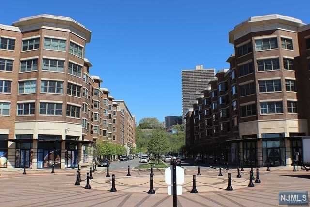 The largest one Bedroom in Grandview at Riverwalk! Live in this spacious 923 sf of luxurious living space from this penthouse unit featuring wood floors throughout, Juliette balcony, kitchen w/ granite counters, stainless steel appliances, 10 ft ceilings, Marble tiled bathroom w/ jacuzzi and laundry plus storage in the unit! Rent includes one in-building garage space and water. Full amenities: 24 hr concierge, security, gym, clubhouse, outdoor swimming pool and business center. Retail on site: Starbucks Cafe, Supermarket, Children's House of Play, Palates & Yoga Spa, Nails & Spa, Cleaners, Ice Cream Store, Wine Gallery, Bank and many Restaurants. NY Waterway free shuttle from building to Ferry & the Hudson Light Rail/Path to NYC in minutes, plus NJ Transit Bus to Lincoln Tunnel or George Washington Bridge. It's definitely a commuter's dream!