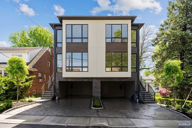Welcome to 820 Kingsland Lane. This brand new construction duplex unit provides 3,400 square feet of luxury living, along with extreme convenience in the highly desirable town of Fort Lee. On the main floor, you are treated to a large and open floor plan featuring a spacious living room with built-in gas fireplace, built-in speaker system, and accent lighting, a custom kitchen with grand center island, top-of-the-line appliances and high end finishes, as well as a dining area and deck to the rear of the unit, and a powder room for guests. The second floor hosts a master bedroom with an abundance of closet space, and a master bathroom with a soaking tub, stand-in shower and double vanity. The second floor also has two more oversized bedrooms with a full bathroom and laundry room. The ground floor features a two car garage, a rec room and a full bathroom. Perfectly situated in close proximity to schools, parks, shopping, and transportation. Listing Agent is part owner of property.