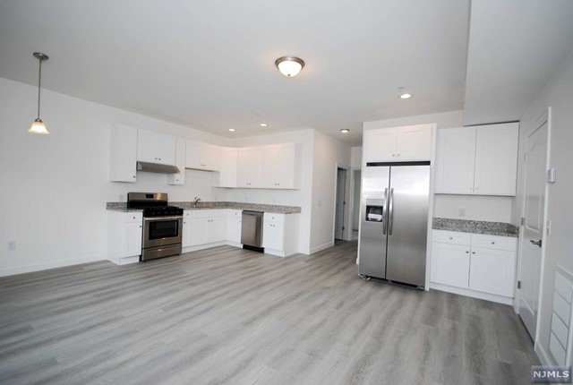 Welcome home to this brand new 2 bedroom, 2 bathroom second floor apartment. This unit features Stainless Steel appliances, hardwood floors, recessed lighting, Central A/C, Washer & Dryer in unit, has its own entrance, 2 assigned parking spaces. A commuters delight! Please be advised the flooring is hardwood floors, not the flooring that is reflected in the photos. Floors are dark hardwood floors.