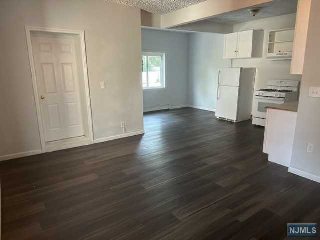 Welcome to this beautiful move in ready renovated 2 Bedroom apartment! Located near tons of transportation and shopping areas! This 2nd floor apartment has an open living concept with 2 bedrooms and 1 bathroom! Both bedrooms have have generous sized closets! Enjoy your morning coffee on your very own deck that leads right down to the large backyard! This spacious apartment will not last! Be sure to reach out to schedule your private showing today! *Owner holds real estate license.