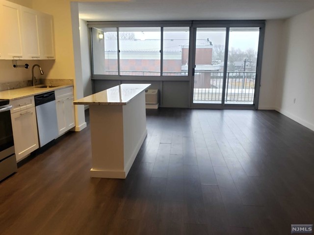 Welcome Home! This apartment home offers hardwood floors, 30 ft wide balcony & all large windows. YES, ALL UTILITES ARE INCLUDED! LL covers your WATER & ELECTRICITY. PET FRIENDLY. Oversized windows allow lots of natural light into this lovely home. Move right in and enjoy the convenience of walking to shops, markets, schools and much more. Just steps to NYC transportation and minutes' drive to NYC. Enjoy the 'no frill' easy living. Morning to evening concierge service, 24 emergency maintenance, indoor garage parking & limited outdoor parking spaces, mall level access to shopping, pet walk and so much more! On-site storage space and garage parking available for additional cost.