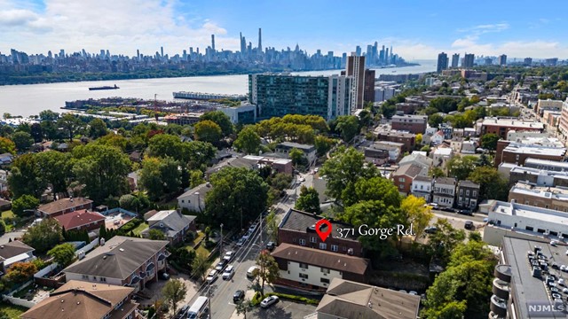 *AAA location* A dramatic, *income-producing 6 FAMILY UNIT* on prestigious Gorge Rd in Cliffside Park. Convenient access to transportation options such as buses, ferries, and light rail; commuting to Manhattan is a breeze. Tenants will appreciate the short travel time to Midtown and Downtown NYC, allowing them to enjoy all the benefits of city living while residing in the tranquil setting of Cliffside Park. *** INVESTOR'S DREAM!!!Meticulously cared for years, hardwood flooring inlays, roof just 10 years old , new energy efficient boiler * 6 Car Parking, and much more. This rare gem has same ownership for the last 40 years. The building is fully occupied and generates a net annual income of (5.8%) per year with potential rent of (6.7%). This beautiful boutique building is an investment opportunity not to be missed on the most desired street of River Road.
