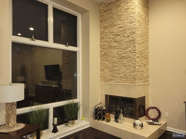 Move-In Condition. Beautiful 2 bedroom condominium with tons of inside privacy. Gorgeous cathedral ceilings with corner fireplace, skylights, tons of natural light. New kitchen with breakfast counter and dining room. Bedrooms on separate floors with plenty of closet space. Master Bedroom is over sized with on suite bathroom including large jetted tub. This condo has some NY city views and is beautifully maintained. Comes with attached garage and outside parking. This one is not to be missed. You will not find nicer condominium living at this price. Make appointment to view today. text 201-925-0005