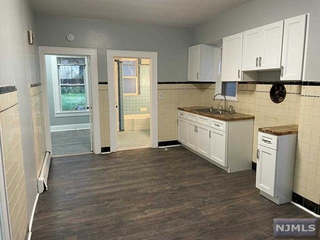Beautifully renovated and spacious 1st floor 3 bedroom apartment conveniently located near shops, restaurants, schools, parks and public transportation. This unit also has an option for additional storage and will also have coin operated laundry units installed in the basement. All units have access to the yard.