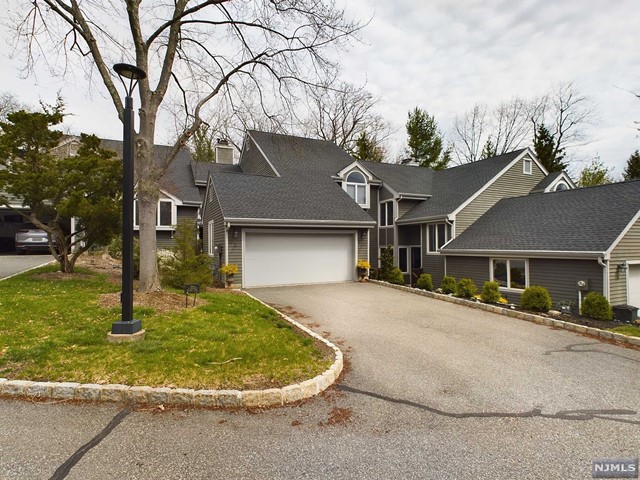 Beautiful, fully-renovated, 3,000+ sq ft luxury townhouse in a small, private and quiet development. The home features three bedrooms, two and a half bathrooms, a sunken living room with vaulted ceiling and a fireplace, full dining room, office and a brand new eat-in kitchen with quartz countertops, tile backsplash, stainless steel appliances, new solid wood cabinets and a full pantry, mud room and a large, fully finished basement with a wet bar and tons of storage room. The bedrooms are large with ample closet space. The master bathroom is brand new and features radiant heat flooring, dual showerhead with rain-shower, twin-sink vanity and a jacuzzi tub. The home has a private rear deck and a covered front deck equipped with TV outlet and lighting. Two-car attached garage complete with Tesla charger and entrance to mudroom. Includes all window shades and luxury light fixtures. Landscaping and snow removal included.