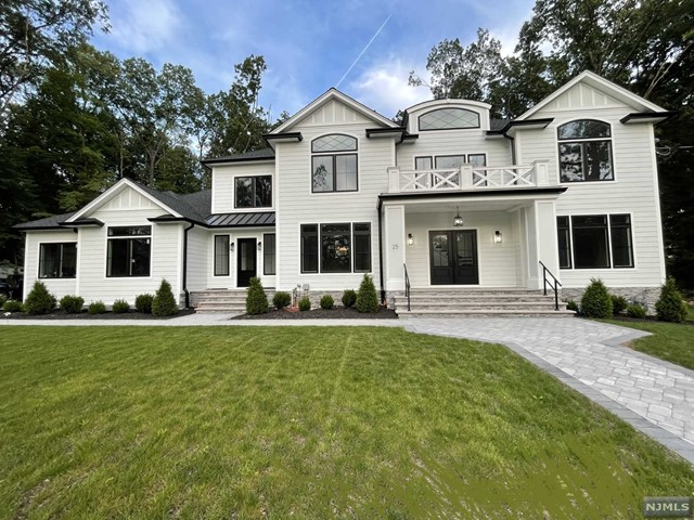 This brand new 5-bedroom, 5.5-bathroom colonial in Fardale section offers over 4,800sqft of living space on 1.04 acres. The first floor is designed for entertaining with a spacious formal living room, banquet-sized dining room, an oversized center island kitchen with high-end appliances, a dining area, and a stunning great room with a FPL, 1200sqft terrace. There's also a guest en-suite bedroom, mudroom, butlers pantry, powder room. Upstairs, the primary suite boasts 12ft high ceilings, a luxurious bath, a sitting room with a FPL, custom walk-in closets & XL terrace. Three more en-suite bedrooms and a laundry room complete this level. Notable features include radiant heat in all full baths, an electric car outlet in the 3-car garage, 7"engineered wood floors by Pianato Legro, 9ft high ceilings, 10 zone sprinkler system. The basement offers endless potential with 10ft high ceilings, has a French drain. Experience a blend of sophistication, comfort, and modern living in this Mahwah.