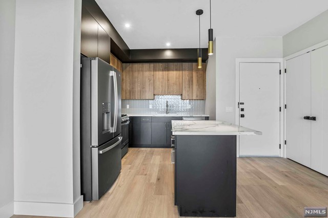 Welcome to LADDERMAN VIEWS! A Boutique 18 Unit Elevator Building Located Near Fort Lee's Main Street & The George Washington Bridge. Unit 203 Features 2 Bedroom, 2 Full Bathroom & 1236 SQFT. Equipped with High End Finishes, Modern Two Tone Cabinets, Quartz Kitchen Island + Countertops, Andersen Windows and Washer & Dryer In Unit. Two Bedroom Units Feature Heated Floors in Bathroom! Other Features Include: Virtual Door Assistance, Covered Parking, Elevator & Dedicated Mail & Trash Rooms. Conveniently Located Near Parks Shopping, Restaurants, & Transportation.