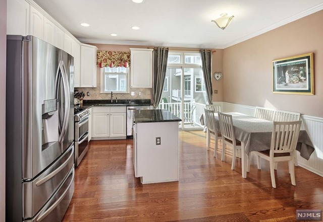 Extraordinary waterfront Essex style home just four units from the water!!! Two balconies and a patio. One of only a few floor plans with no one above or below you. Fabulous NYC and Hudson River views!! Gourmet kitchen with granite counters, island, stainless steel appliances and custom back splash. Extra full bath in loft!! Wide plank hardwood floors. Parking for two cars-one in garage and one in driveway. Community features two pools with Jacuzzis, tot lot, waterfront promenade and free shuttle to ferry and light rail. Steps to 158 bus to NYC. Close to restaurants and shopping. A MUST SEE!!