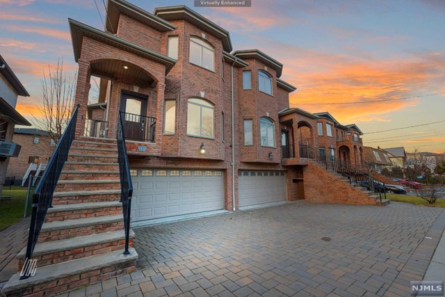 This 3BR/3.1BA property evokes sheer sophistication w/ an impressive brick exterior & a custom paver driveway. Embracing upscale elegance, the sundrenched main-level features an open floorplan, beautiful wainscoting, wood flooring, an expansive living/dining area & a gourmet EIK w/ SS appliances, granite counters & the large deck. Nestled on the upper-level, the MBR dazzles w/ vaulted ceilings, sitting nook, two closets & an en suite boasting a jetted tub, separate shower & dual sinks. Entertain in the lower-lvl recreation room, which has guest-suite potential w/ a separate entrance, kitchenette/wet bar, a closet & a full bathroom. Other features: 2-car garage, top-floor W/D, near shops, dining highways & NYC buses! No smoking/pets. Renter's insurance w/ $300k liabilities req'd. Income & employment verf, credit check & interview req'd. Due at signing 1mo rent, 1.5mo sec dep, 1mo broker fee. $40 credit app. Tenants are responsible for lawn care, snow removal & all of the utilities.