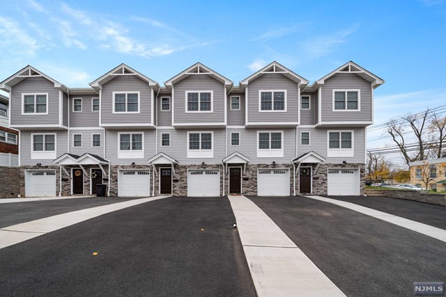 Welcome to this BEAUTIFUL NEWLY RENOVATED TOWNHOME! You won't be disappointed by this gorgeous home! The ground floor has a office/gym and one car garage. 1st floor features updated kitchen, living room, dining room and enclosed patio! Second floor features two large bedrooms, the primary bedroom offers an ensuite! The attic is full, but unfinished. There is a one and half zoned central air system. Low HOA fee of only $150 monthly covers lawn maintenance, exterior and common roof insurance, and any emergency items for the property. This well maintained property is only minutes away from NYC and close to public transportation! This GEM WON'T LAST LONG! Schedule your in person showing today and view the photos, video, floor plan and 3d design of the property! Make this house your home just in time for the holidays!