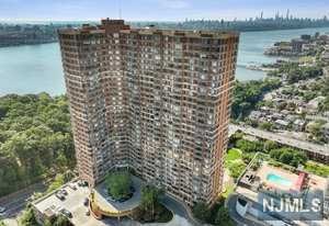Renovated two bedroom and two bathrooms in The Palisades. End corner unit with panoramic views. Very spacious and open floor plan. New custom floors throughout. Custom finished closets with beautiful wood interiors. The half bath has been converted into a large closet. Primary bath has a modern glass shower and the second bath has a jacuzzi. All new tiling throughout. Beautiful east NYC and western sunset views. Two indoor parking spaces. Doorman,24 hour security, visitors valet, gym, children's playroom, community room, outdoor pool and beautiful plaza area with BBQ. Close to stores, restaurants and NYC transportation.