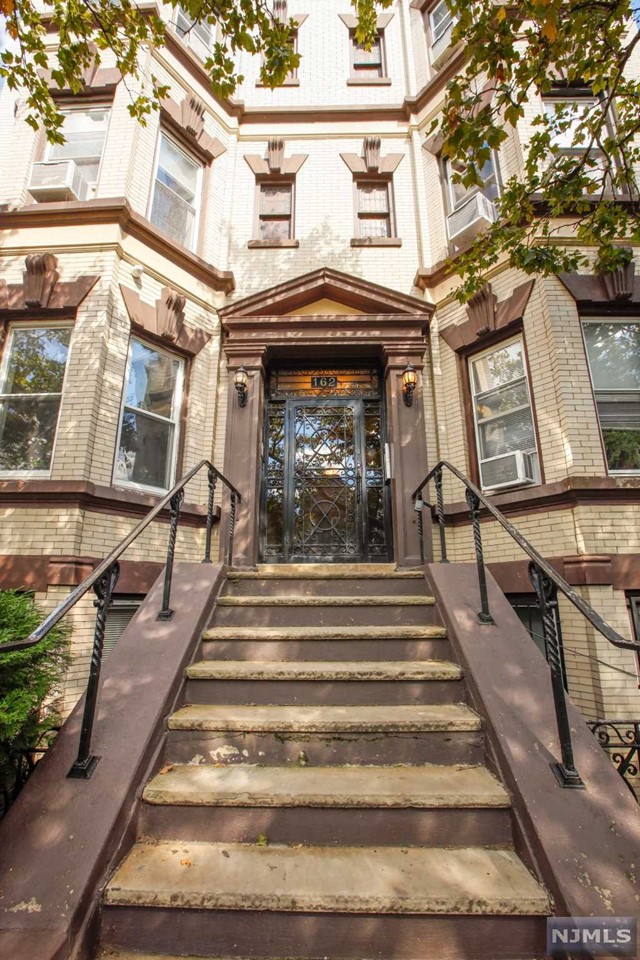 Welcome to your renovated 3 bedroom condominium in a well maintained Prewar building. Experience abundant natural light from the Southern and Eastern exposure. The custom dining/living room with original wainscoting, beamed ceilings and stunning pocket doors make this home perfect for entertaining. The large kitchen boasts granite countertops, stainless steel appliances and adjoining pantry. A secondary living room with its own entrance can be used as a home office and serves as a perfect guest space. A laundry area is available in unit with additional storage in the lower level. This condominium is being offered with one deeded parking spot which is included in the sale. Come experience all this neighborhood has to offer including farmers markets, galleries, trendy eateries, shops and many public amenities. Close proximity to the PATH, Lincoln Park and Journal Square.