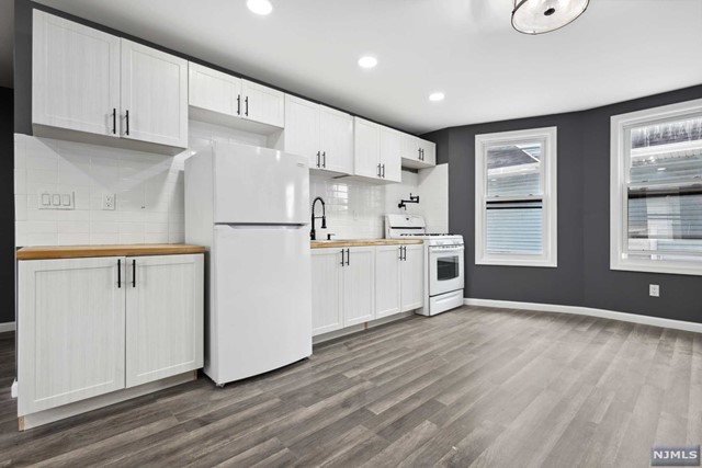 Introducing 73 Orange Ave Unit 2 in Irvington, NJ! This newly renovated unit features a modern style with captivating dark grey walls. Boasting 4 bedrooms and 2 bathrooms, there's plenty of space for comfortable living. The kitchen showcases all new white appliances, adding a sleek touch to your culinary experience. To secure this unit, a 1.5-month security deposit, first month's rent, and one month's broker fee are due at signing. Enjoy the convenience of one parking space. Background and credit checks are required. Don't miss out on this fantastic opportunity!
