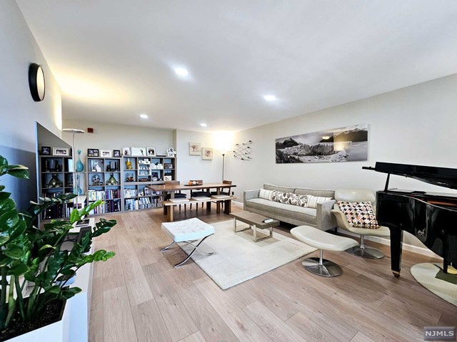 This luxury condo 2beds and 2 baths in Cliffside Park has been completely renovated for a sophisticated and modern living space. The kitchen features upgraded stainless steel appliances, and the bathrooms have been fully upgraded to exude a luxurious atmosphere. The entire home is freshly painted and fitted with wood flooring throughout. Balcony windows have been replaced ($20,000) and recessed lighting installed, ensuring a quiet and fully renovated home. Enjoy the private terrace for outdoor relaxation. Conveniently, there is a laundry room and storage space on the same floor. The building offers numerous amenities, including a doorman, fitness center, and outdoor swimming pool. Its location provides easy access to major roads and shopping areas, blending luxury and practicality.