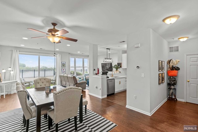 Lavish and visually stunning, this beautifully designed northeast facing 2 Bedroom / 2.5 Bathroom townhouse with NYC and Hudson River views accentuates a suburban feel with its Bergen Model layout!. Optimizing in an exceptional design, this duplex stretches across 1444sqft featuring wood flooring on the main level, an integrated chef's kitchen w/white cabinetry with plenty of storage, SS appliances, and breakfast bar open to the living and dining room with a private patio & half bath. Make your way up to the second floor features the primary ensuite with a large walk-in-closet and spa-like bath with dual vanities and a separate tub and shower with your own private balcony overlooking the city. Spacious 2nd bedroom with a full bath in the hall. Enjoy the in-unit W/D & 2 car parking (1 inside garage and 1 outside). Located in the Jacobs & Bulls Ferry community, this community offers 2 outdoor pools, Jacuzzi, 24hr security, free shuttle to/from ferry terminal, & easy access to NYC.