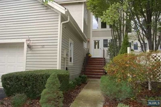 Beautiful Large Townhome w lots of bonus space! This home offers an inviting foyer with a beautiful custom kitchen! Living room with fireplace! Master suite with fireplace, walk in closets and Junior Master suite on 2nd level! Huge Basement with custom designed office areas, large rec room, full bathroom with a Sauna!! Tons of storage space and work areas!! Patio w pavers! Garage also has a loft with tons of storage!! Community Room with Tennis Court and In Ground Pool!