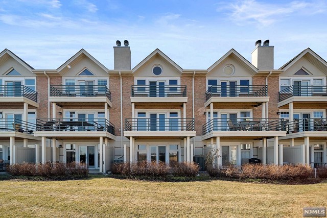 Welcome to the gated Grand Cove Townhouse Community with a total of fifty-one two and three bedroom townhouses. 39 Grand Cove is a true 3 bedroom townhouse facing east--right on the Hudson River with an attached two car garage. The kitchen has been reimagined to incorporate bar seating and open up to the large dining room. New lighting, fresh paint, stainless appliances, natural stone counters and more. Large living room with terrace and fireplace. Master bedroom also has terrace and organized walk-in closet. Hardwood flooring on both the main and second level. Ultra large family room with tile flooring on the lower level with a walk-out patio. Fabulous river view, bright and sunny!!!