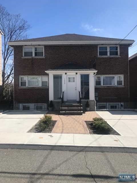 LOCATION ! LOCATION !! LOCATION !!! BEAUTIFULLY RENOVATED DUPLEX situated on a quiet residential street, just a few blocks to Main Street and 3 minutes by car to George Washington Bridge and Major Highways. Tastefully Remodeled THREE (3) FLOORS of LIVING SPACE. Open floor plan 1st floor has recessed lighting and gleaming hardwood floors throughout the living room, dining room, and modern kitchen w/ stainless steel appliances & granite counter top. Bright and Airy 2nd floors Bedrooms with hardwood floors and renovated bathroom . Finished ground floor with walk out to driveway and backyard has recessed lighting and hardwood floors, perfect family room, office and/or 3rd (guest) bedroom, laundry room w/ new washer/dryer and half bath. Rent include one parking space. Close to public transportation, shops, restaurants, parks, schools and etc. A MUST SEE !!!