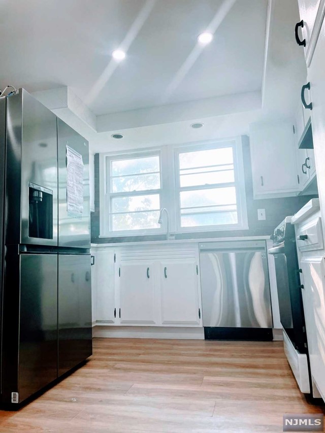 LOCATION! This lovely Unit is located on Floor 1 of a 2-family home in the sought neighborhood of Bloomfield! This home sits on a corner lot with smart locks and multiple windows offering an abundance of natural light throughout. You'll be welcomed by a spacious Living room and formal Dining room perfect for entertaining as well as 3-bedrooms with dedicated closets. Both the eat-in kitchen and full bathroom were recently updated featuring new refrigerator, dishwasher, countertops with brick-face backsplash along with ample cabinetry. Heat utility, off-street parking for 1-vehicle and usage of yard included in rent! Pets up to 20lbs allowed for an additional monthly fee. Convenient to Montclair State University-Bloomfield College campus, Hendricks Golf course, Glen Ridge, Newark Penn station with mass transit to NYC, Newark International Airport and much more. First month's rent, security deposit and Realty fee due at lease signing. Act now and make this your new home today!