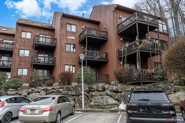 Great Gorge Village premieres this spacious 2 Bed 2 Bath furnished Townhome with stunning mountain views, ready & waiting for you! A great, versatile layout, the main level offers a light & bright open Living/Dining combo with newer flooring and a cooling modern palette, easy to customize. Sliders here open to your own private Deck, boasting beautiful mountain views that will take your breath away. Galley Kitchen offers SS Appliances, breakfast bar, ample cabinet storage & tiled flooring. One generous Bedroom, the main Full Bath & convenient in-unit Laundry closet round out the main level. The lower level holds the spacious Primary Bedroom with faux Fireplace & slider to the lower Deck. Sizable Family rm (or 3rd Bedroom, Home Office, etc) & 2nd Full Bath, too! Newer flooring, Central Air/Forced Heat and more. All in a great location, close to Minerals Resort Spa, restaurants, fitness center, skiing, snowboarding, hiking, biking, all resort amenities & mins to Mt Creek!