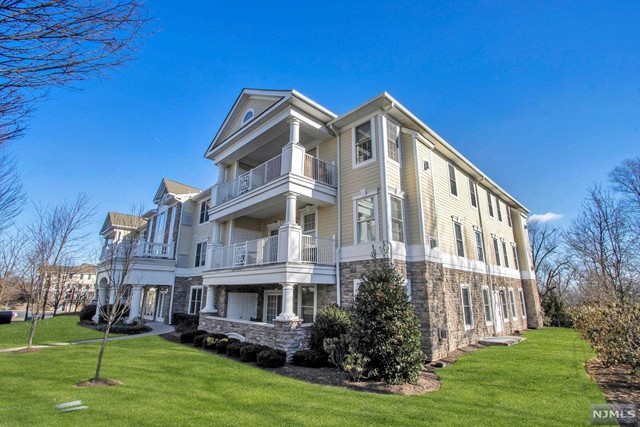 Immaculate upscale condo with gleaming hardwood floors and high ceilings throughout! Welcome to Four Seasons, sought after 55+ Community! Step into luxury with a welcoming foyer that leads into a large and bright formal living room with sliding doors to a spacious balcony. Beautiful gourmet kitchen is complete with a large center island, cherrywood cabinets, granite countertops and stainless appliances. Large family room, open to the kitchen, includes a cozy fireplace - great for entertaining. Luxurious primary suite featuring a walk-in closet and updated full bath with a double vanity, jetted tub and separate shower. Additional spacious bedroom, updated full bath and laundry room completes this beautiful condo. Amazing amenities include an outdoor pool, clubhouse with a kitchen, bocce court, fitness room, putting green and card/game room. Close to stores, restaurants and all transportation!