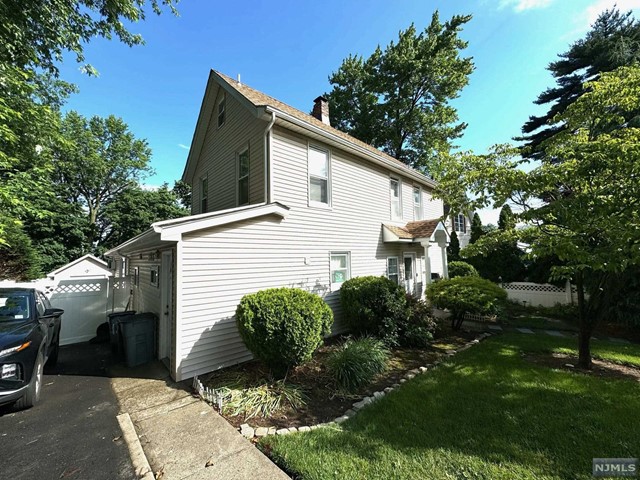 This charming 4-bedroom, 2-bath home is perfect for families seeking comfort and convenience. Located in a quiet neighborhood, the property boasts a spacious yard, ideal for outdoor activities and gardening. A detached garage and long driveway offer ample parking and storage space. Plus, being close to transportation ensures easy commutes. Don't miss out on this ideal blend of tranquility and accessibility!
