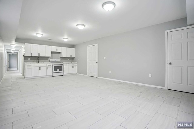 Welcome home to this beautiful brand-new construction. 2nd floor apartment with 3 nice sized bedrooms including nice master suite with master closet and bath. Another full bath on the same level. Large living room/dining room area and beautiful brand-new kitchen with white shaker cabinets, appliances and quartz counter tops. Central air/heat. Plenty of natural sunlight. Brand new everything! Perfect location on the border of Woodland Park and 2 blocks away from route 80. You can be in NYC within 25 minutes. Close to all major highways, transportation, shops, restaurants, and places of worship. MOVE IN READY