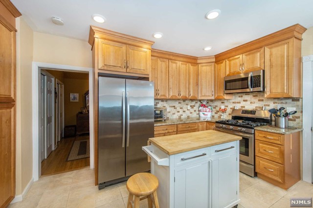 Three Bedroom Rental in the heart of Nutley with LAUNDRY IN YOUR UNIT! Beautiful apartment with a spacious layout. Unit is comprised of entire first floor and basement in a two family home. First Floor features Kitchen with Granite Countertops and Stainless Steel Appliances, Living Room, 2 Bedrooms, and Bathroom. Basement features another bedroom (could be used as a living or family room) and plenty of storage space with a separate entrance. Flexible layout allows options... One of the bedrooms upstairs can also be used as a living room / home office etc. Two parking spaces included in the driveway. Close to restaurants, shops, and EASY COMMUTING into NYC from this location. A Small pet may be considered. Sorry, no smoking. Credit Check, proof of income, and 1 month broker fee required.