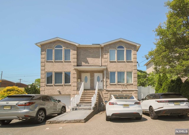 Young, bright, and well-maintained duplex in the prime location of Hackensack. This three bedroom, three full bath, and one half bath unit features bright natural lighting throughout the day along with great flow. Enter into the living room which flows effortlessly into the dining room then the eat-in kitchen with a breakfast nook and powder room. Second floor offers two generous sized bedrooms along with the master suite which is complimented by its ensuite master bathroom. Lastly, the full and finished ground floor features a recreational room, full bathroom, and access to the patio making this space perfect for any form of entertainment. Full security surveillance system along with fencing around the home has been installed for maximum convenience. Location offers close proximity to NYC transportation, shopping, dining and more.