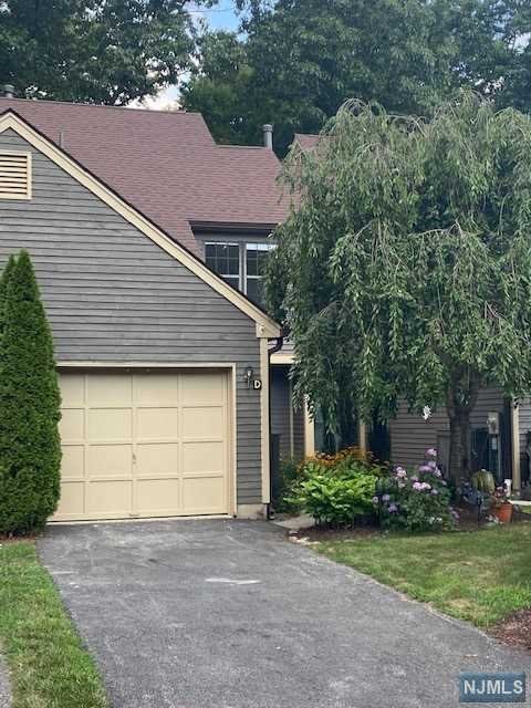 mmaculate tri level town homes with large EIK and cathedral ceiling. Family room with fire place and sliders to private back yard. Two primary bedrooms on two separate levels with bath. One car garage.