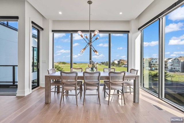 Expansive living awaits with 3,100 sqft of direct ocean views featuring five bedrooms and five full bathrooms. Home includes private elevator that takes you conveniently to each floor. Spectacular private roof top deck with a Lynx gas grill and fire pit overlooks the beautiful Atlantic Ocean. Interior upgrades include elegant open glass railing staircase with Artic White Stone accent wall throughout as well as Walnut TV Feature Wall. Option available to fully furnish your new home with Restoration Hardware Designer Furniture Package. Fully outfitted Chef's kitchen with Sub-Zero and Wolf appliances, Ceasarstone Frosty Carrina quartz countertops, and Ultra Craft l Artic White Cabinetry. Spacious attached two car garage with Clopay Avante door with frosted glass. This home is part of the Platinum Collection with Eastern facing ocean views, Western sunset views, Northern and Southern Exposures. Amenities include 2 pools, fitness center, community center, & more!
