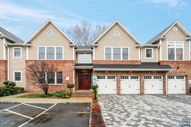 GREAT LOCATION CLOSE TO TENAFLY SCHOOLS AND PUBLIC TRANSPORTATION TO NYC. LUXURY 2 BED 2 BATH CONDO BUILT IN 2010''S AT THE CROSSINGS IN TENAFLY. SOUTHERN EXPOSURE, HIGH CEILING, CENTRAL A/C, CENTER VACUUM, WASHER & DRYER IN UNIT, HARDWOOD FLOORS THROUGHOUT. LIVING ROOM WITH FIREPLACE, GRANITE COUNTER TOP AND STAINLESS-STEEL APPLIANCES IN KITCHEN, PLENTY OF CLOSETS, MASTER BEDROOM SUITE WITH JACUZZI AND WALK-IN CLOSET. THE UNIT HAS 1 CAR GARAGE PARKING AND 2 PARKING SPACES IN FRONT OF THE GARAGE.