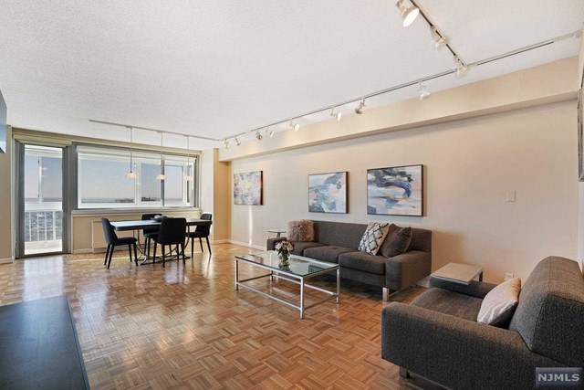 MOVE-IN READY, renovated, largest one bedroom, (approx. 1299 sq. ft) one and a half bathroom line features an 'L" shaped living room and den that can be easily converted to a second bedroom or a home office. Beautiful full height wood cabinetry, stainless steel appliances and granite countertops highlight the kitchen. Unobstructed western exposure affords magnificent sunset views that can be appreciated year round from the enclosed terrace. Parquet wood flooring in living room, dining room and hallway. Ensuite primary bathroom has a soaking tub with sliding glass doors for the shower. Century Tower is a premier luxury co-op building with a full range of amenities, including 24-hr doorman, concierge, outdoor pool, fitness center, community room, kid's playroom, BBQ grills and much more. Fabulous location near good schools, Houses of Worship, restaurants, shopping and easy transportation to NYC. Parking $90. Subject to Board Approval. Don't miss this turn-key opportunity!