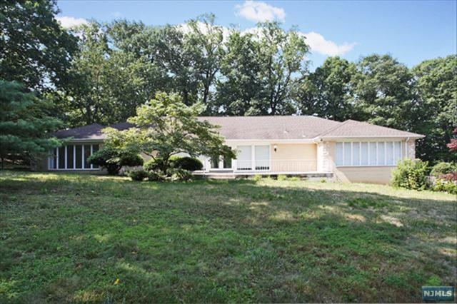 LOCATED IN BEAUTIFUL ALPINE IN ONE OF THE MOST DESIRABLE AREAS OF BERGEN COUNTY. THIS VERY NICE ALL BRICK RANCH LOCATED ON A CUL-DE-SAC IN A VERY SECLUDED AREA, WITH LARGE ROOMS, OPEN KITCHEN AREA, GREAT ROOM, FAMILY ROOM, OFFICE, FOUR BEDROOMS, FOUR FULL BATHROOMS AND POWDER ROOM. VIEW OF THE OUTDOOR PATIO AREA FROM ALMOST EVERY ROOM. HUGE FINISHED LOWER LEVEL WITH HIGH CEILINGS. THREE CAR GARAGE AND LARGE DRIVEWAY WITH PLENTY OUTDOOR PARKING. CONVENIENTLY LOCATED NEAR ALPINE SCHOOL'S AND FULL USE OF TENAFLY'S BLUE RIBBON HIGH SCHOOL AT NO EXTRA COST. MINUTES TO THE GEORGE WASHINGTON BRIDGE TO MANHATTAN, THE PALISADES PARKWAY AND ALL MAJOR HIGHWAYS. NICE QUIET, PEACEFUL AND PRIVATE AREA OF ALPINE!