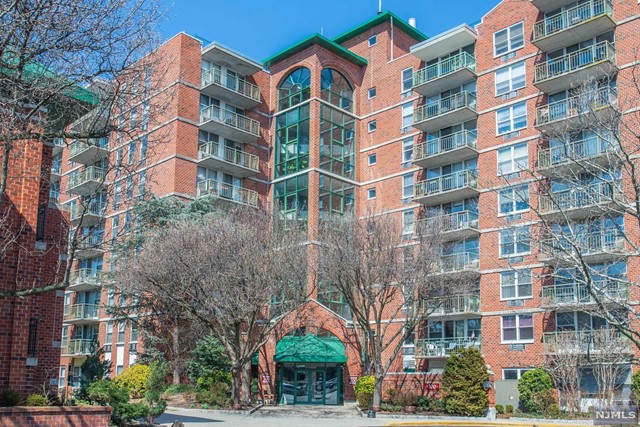 LOOK NO Further ! Sit back and Relax in this Luxurious Corner Updated Unit at the Mill. Pretty Entrance way into the building. You will fall in love with this gorgeous open concept unit. Freshly Painted Large Living/Dining room beautiful views from the Balcony. Renovated Kitchen new Tile all new stainless-Steel appliances. Master BR with large walk-in closet, updated full bath & its own Balcony. Large 2nd BR. Newer stackable Washer & Dryer, all newer energy efficient heat pumps. On site security & 1 covered assigned parking in garage. New State of the art Gym. Community Center, Tennis & Pool. The Mill has everything you need for care free living. Great location, local shops, Restaurants & NYC Transportation.