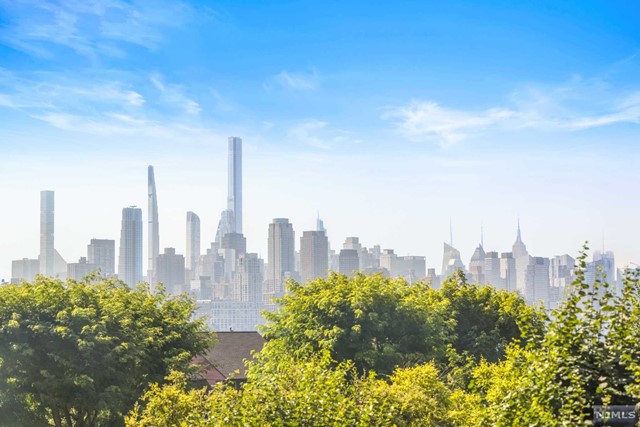 Luxury at its best! SOUTHEAST MIDTOWN MANHATTAN views! 9 ft ceilings,1269 SF, Corner unit, wood floors in Living room, Kitchen Aid stainless steel appliances, Master Bath w/ 2 vanities, large soaking tub, separate glass enclosed shower, lined in creamy marble. Full Amenities include 2 pools (indoor/outdoor), health club, saunas, cinema room, golf simulator, business center, events room, playroom, 2 hotel guest suites + much more! Gas, hot water, 1 in-building garage space and use of amenities included in rent. Private complimentary shuttle to NY Waterway. NJ Transit bus only steps away to Lincoln Tunnel, GWB, Hudson Lightrail/ NY Waterway ferry. Dream commute to NYC.